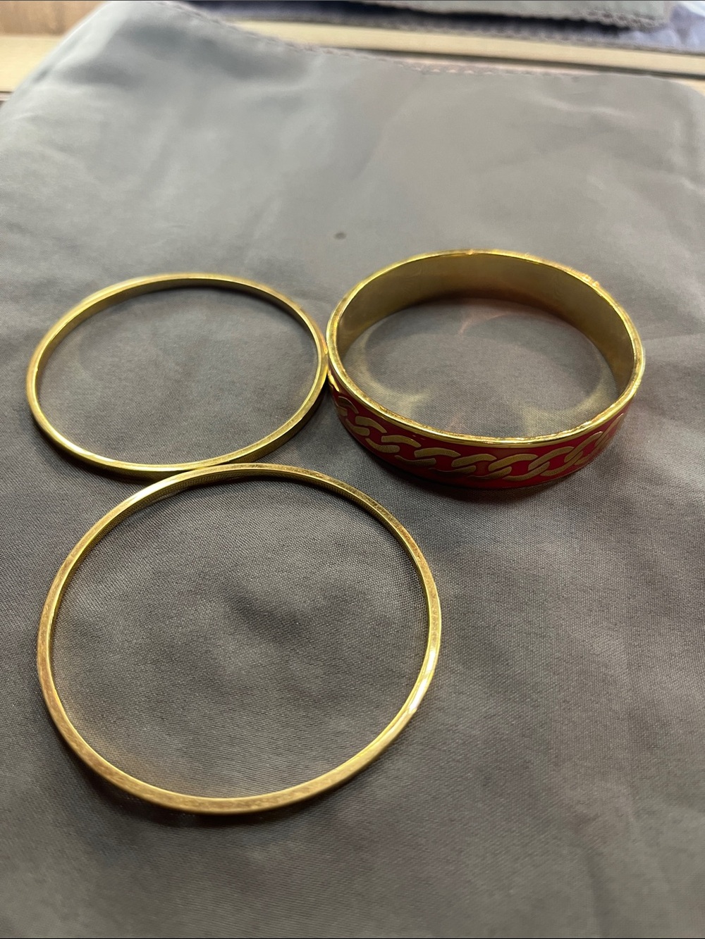 Juicy Couture Gold Tone Bangle Set with Red Enamel Chain Accent